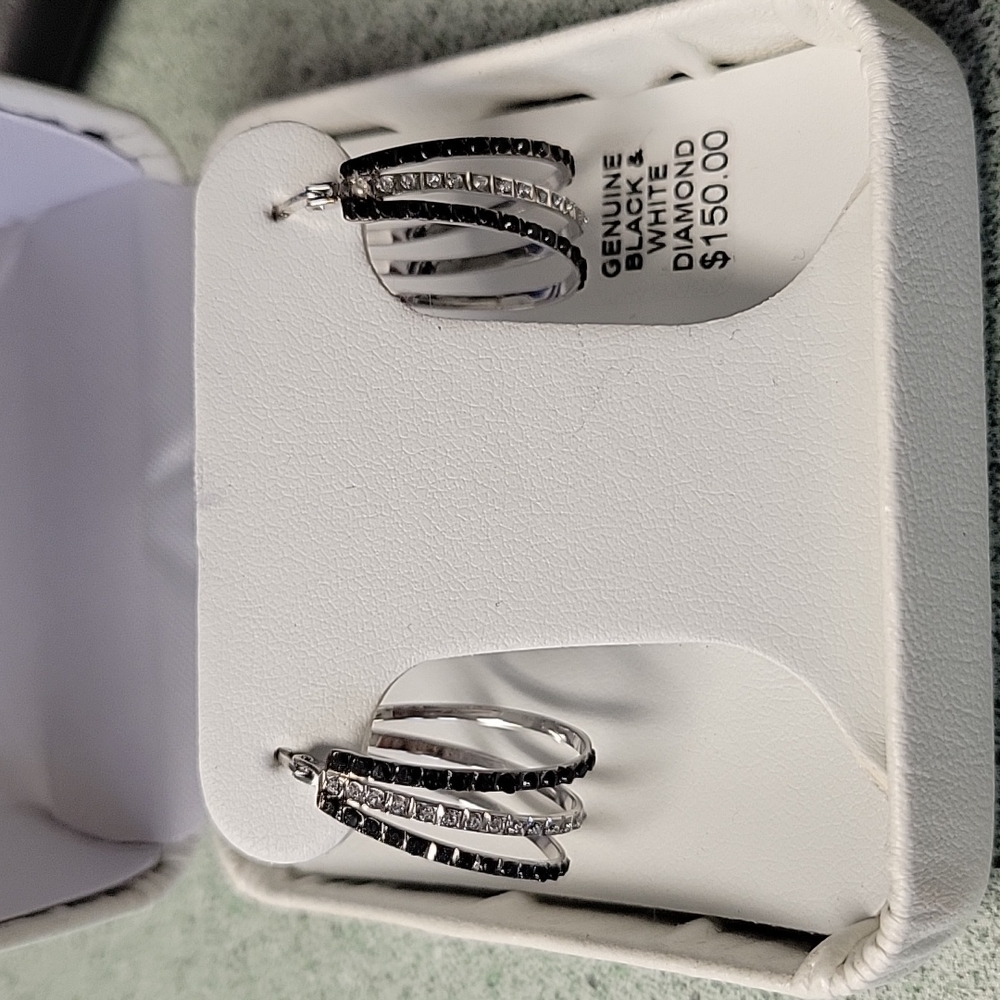 Brand new, never worn black and silver hoop earrings.